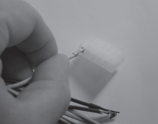 Figure 5-5: Inserting a crimp connector into the connector header.