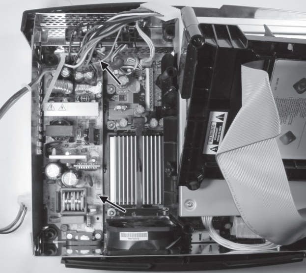 Figure 5-7: Location of the two power supply mounting screws.