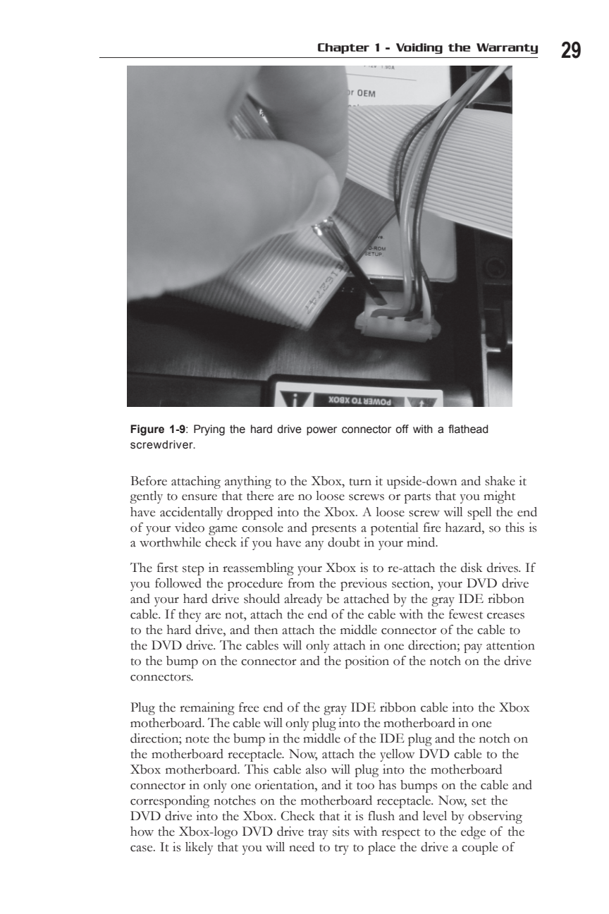 Figure 1-9: Prying the hard drive power connector off with a flathead screwdriver.